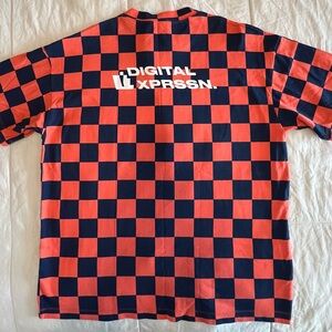 Zara. Bright orange and blue checkered soccer jersey